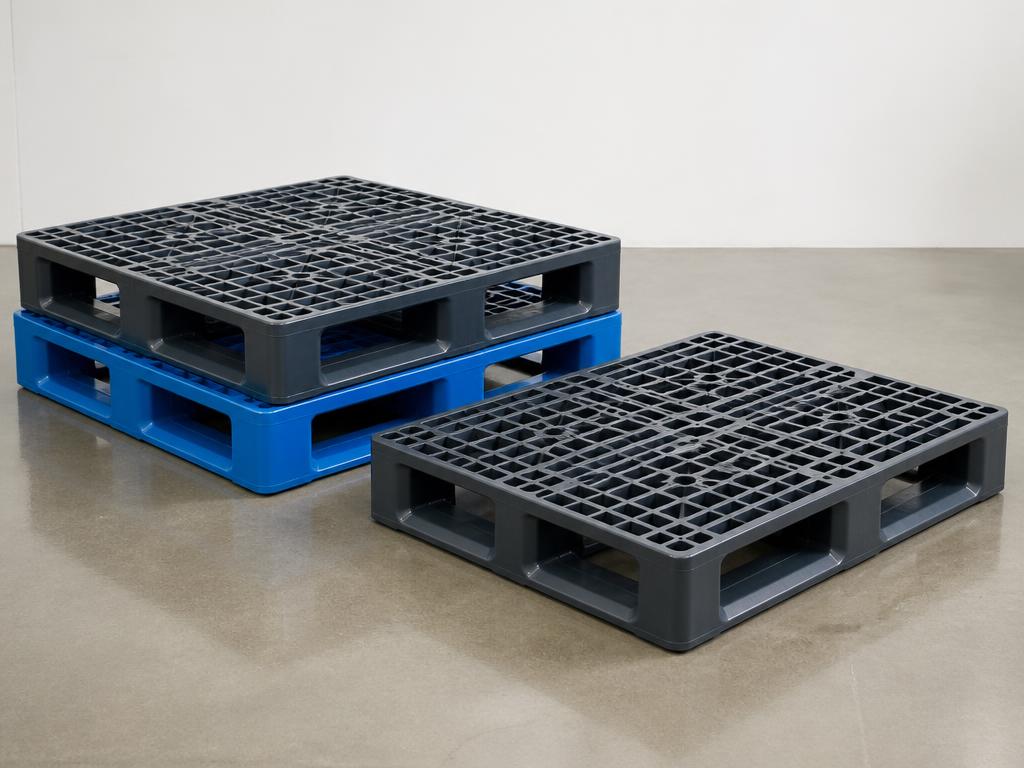 Grey and blue moulded plastic pallets with ribbed open-grid decks